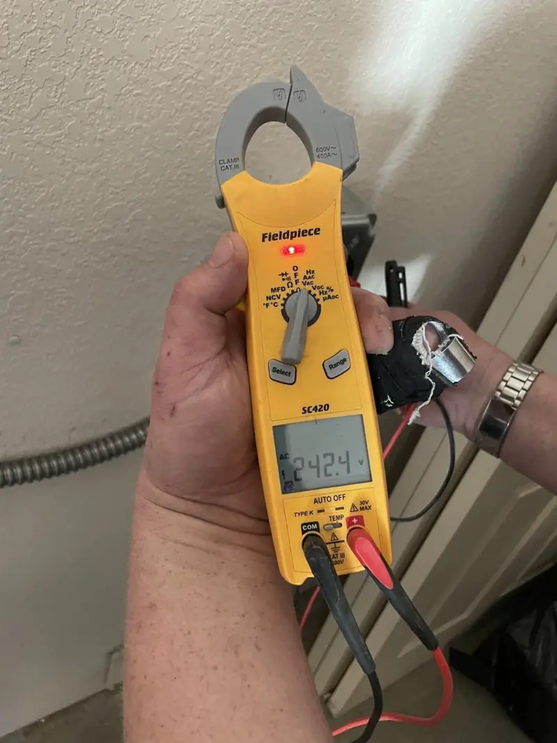Voltage testing with clamp meter during Generator Installation in Richmond Heights